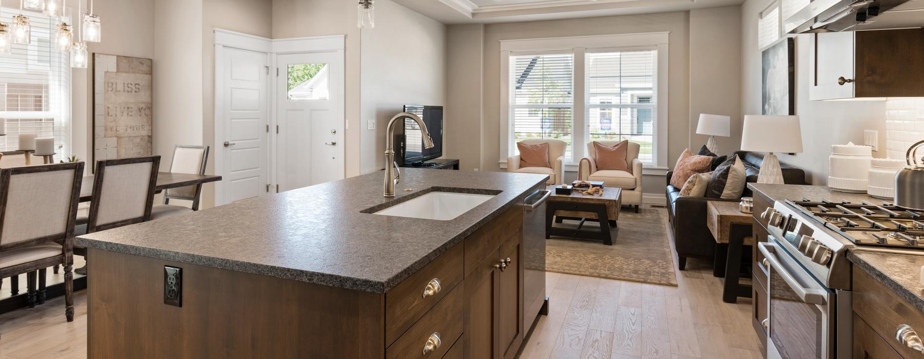 a kitchen with a marble island